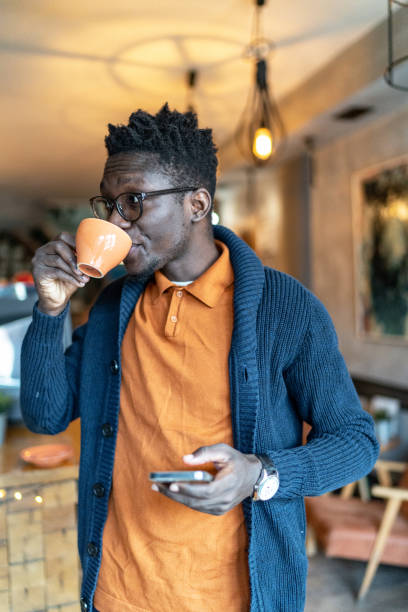 istock Modern man drinking coffee at coffee shop 2012677746