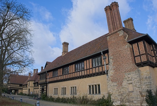 Potsdam, Germany - Jan 23, 2024: In Cecilienhof palace was held the Potsdam Conference where the allies negotiated the fate of the defeated Third Reich. Cloudy winter day. Selective focus