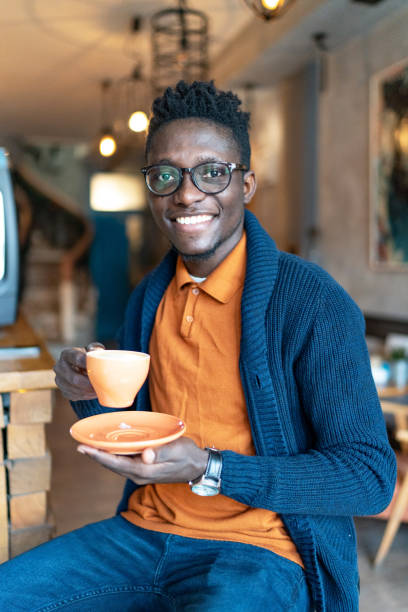 istock Handsome man drinking coffee at coffee shop 2012690156