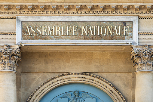 Paris, France -September 6, 2023: Close-up of the sign written on a facade of the courthouse of Paris, with the words 'Tribunal correctionnel' written in French (English translation: 'Criminal court')