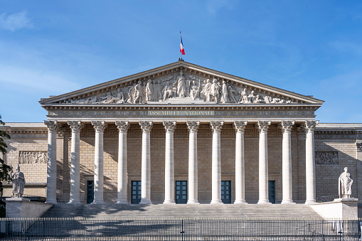 Paris : Palais Bourbon - French National Assembly (Palais Bourbon), with french flag flying. Paris in France