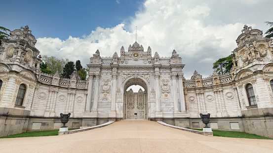 Gate at former Ottoman Dolmabahce Palace, or Dolmabahce Sarayi, suited in Ciragan Street, Besiktas district, Istanbul, Turkey. View from the internal court