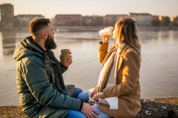 istock Couple drinking coffee outdoor 2012729580