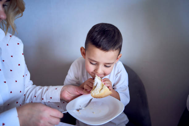 Portrait of happy boy in glasses with a birthday cake. Celebrate Happy birthday. Party. Happy family concept