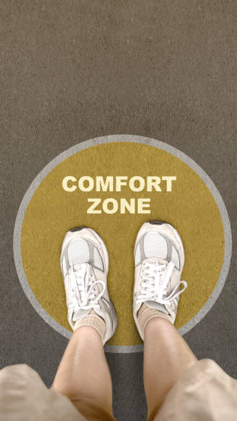 istock People standing on the street with comfort zone text 2012746958