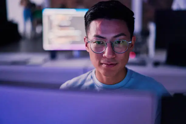 Photo of Businessman, computer or programming code in night office for software development, cybersecurity or database safety. Asian programmer, developer or engineer on technology for web 3.0 coding in dark