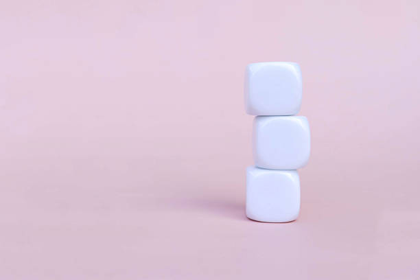 istock white square cube for conceptual design. Education game isolated on pink background. 2012770307