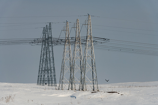 Giant power transmission lines on a sunny winter day