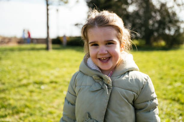 istock Elementary age kids outdoors in park, posing and looking at camera 2012787758