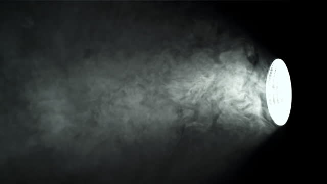 Smoke in studio with lighting projector. Filmed on a high-speed camera at 1000 fps.