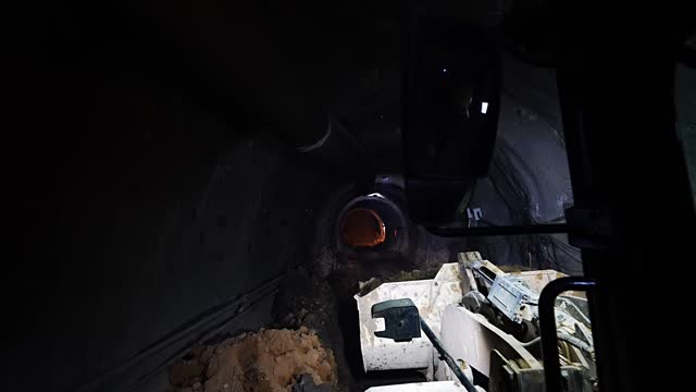 Loader construction equipment at work in Metro NATM tunnel