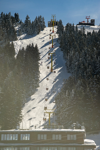 View of a cable car in snowy hill.
