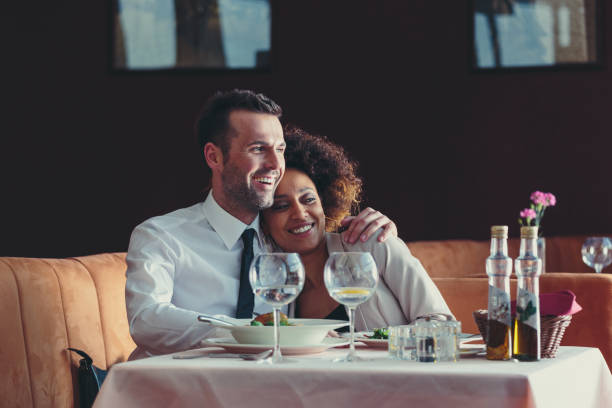 istock Happy couple at dinner in the restaurant 2012805392