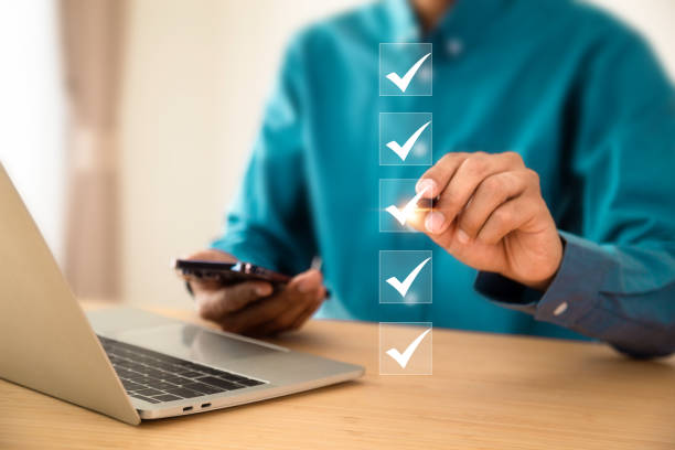 istock Checklist, businessman using checklist survey, filling out digital form checklist, take an assessment, questionnaire, evaluation, online survey, online exam. 2012813993