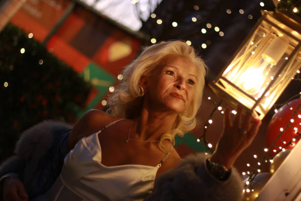 istock Blonde woman Christmas atmosphere night light 2012821763
