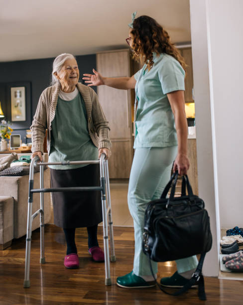 a nurse visits an elderly disabled woman at home and helps her