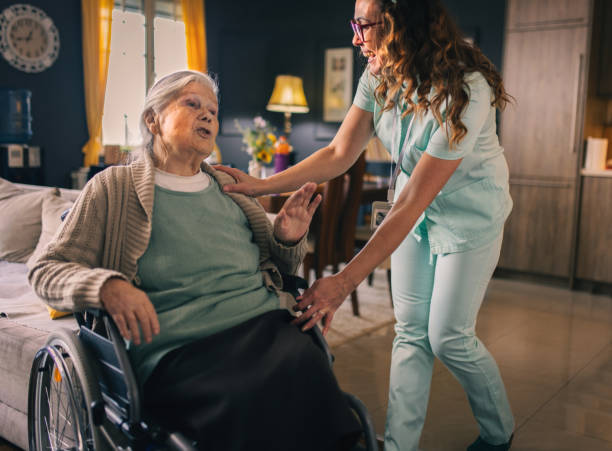 istock a nurse visits an elderly disabled woman at home and helps her 2012824972