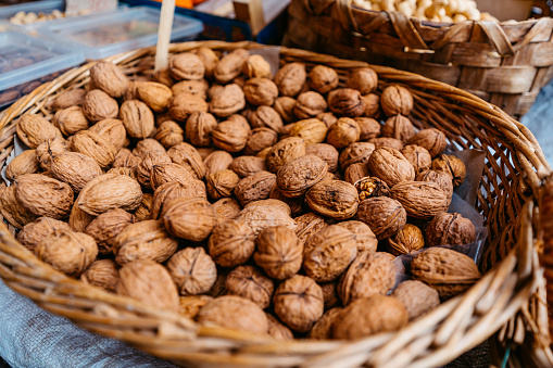 Walnuts in a basket for sale at a market in Catania, Sicily.
