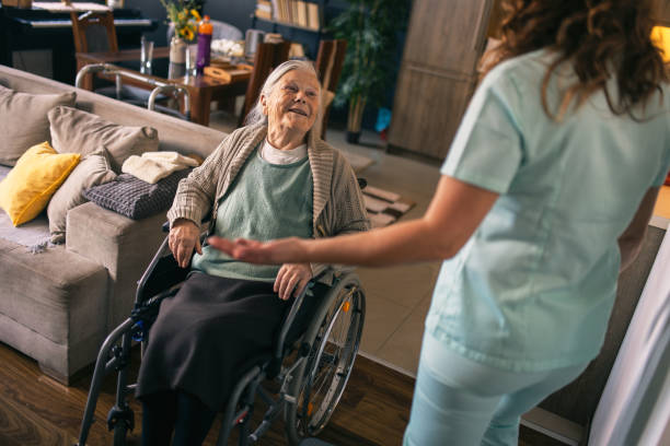 istock a nurse visits an elderly disabled woman at home and helps her 2012829270