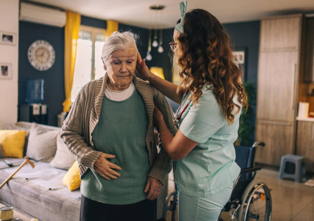 istock a nurse visits an elderly disabled woman at home and helps her 2012831409