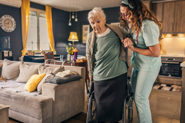 istock a nurse visits an elderly disabled woman at home and helps her 2012831982