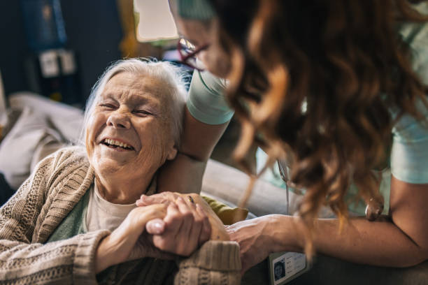 istock a nurse visits an elderly disabled woman at home and helps her 2012834643