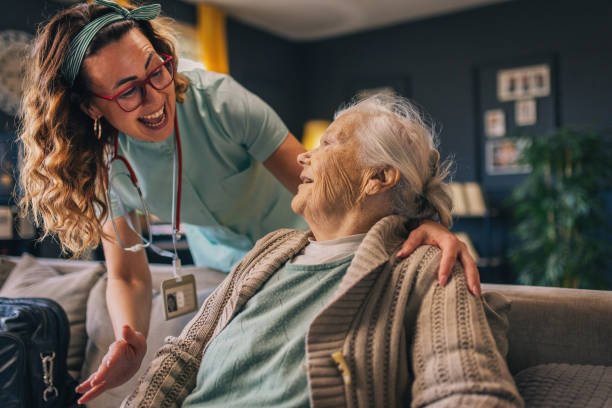 istock a nurse visits an elderly disabled woman at home and helps her 2012834652