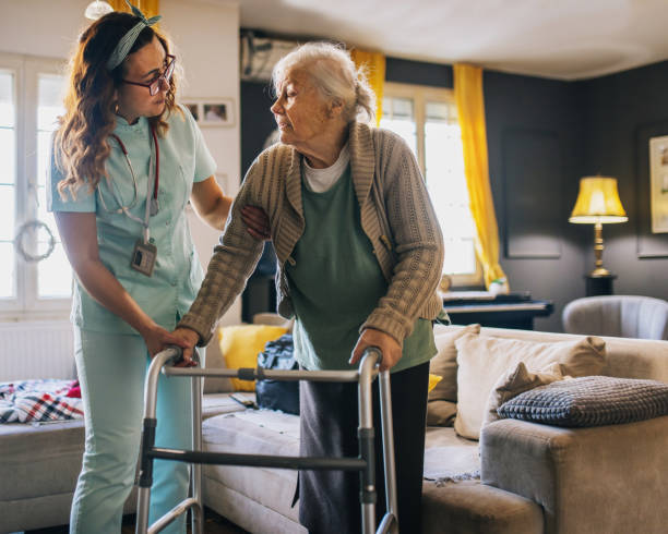 istock a nurse visits an elderly disabled woman at home and helps her 2012840008