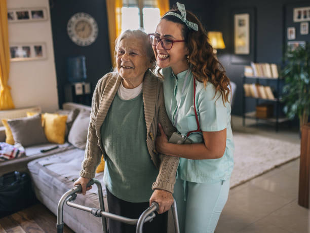 istock a nurse visits an elderly disabled woman at home and helps her 2012844340