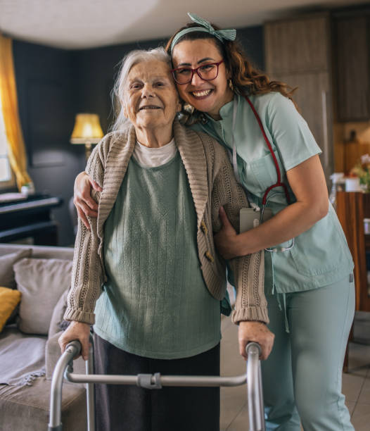 istock a nurse visits an elderly disabled woman at home and helps her 2012844880