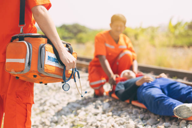 istock paramedic mobile car medical emergency team working in action help first aid save people life at accident site outdoors 2012849192