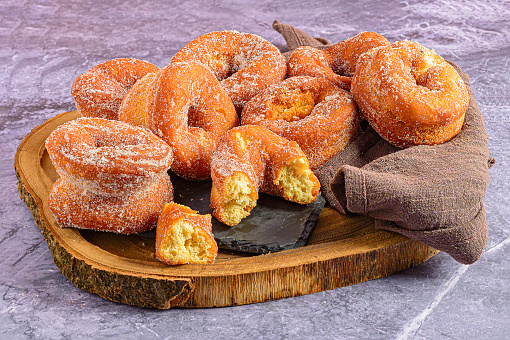 Gastronomic Still Life: Aniseed Donuts on Slate and Kitchen Towel