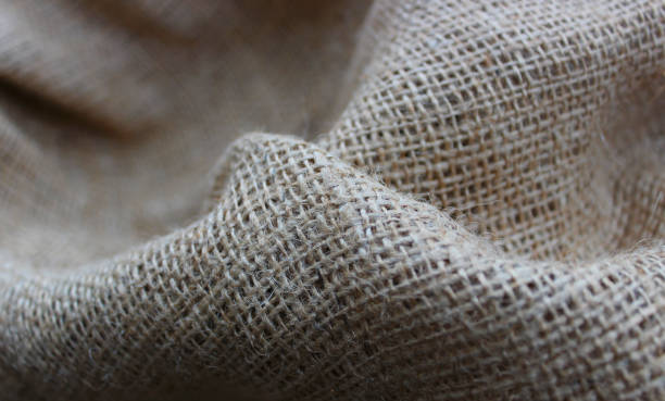 istock Handicraft Open Weave Burlap Folds Closeup View. Rough Crumpled Burlap Background 2012876508