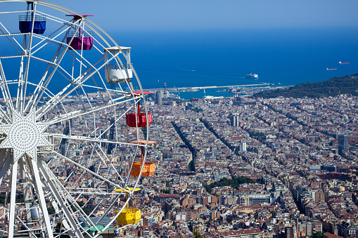 An aerial view of Barcelona and the ferris wheel from Mount Tibidabo.