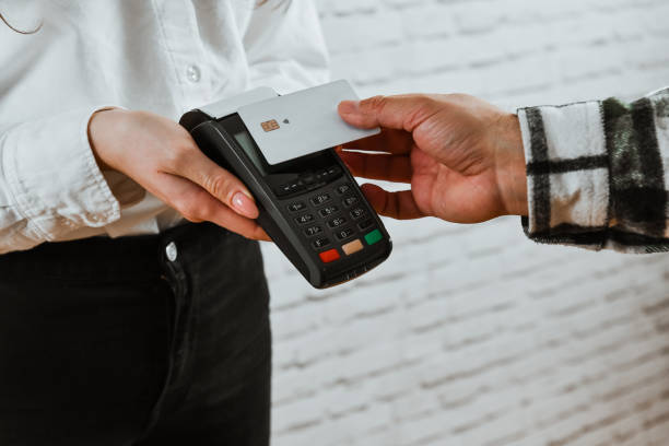 istock Male Customer Using Contactless Credit Card Payment 2012882839