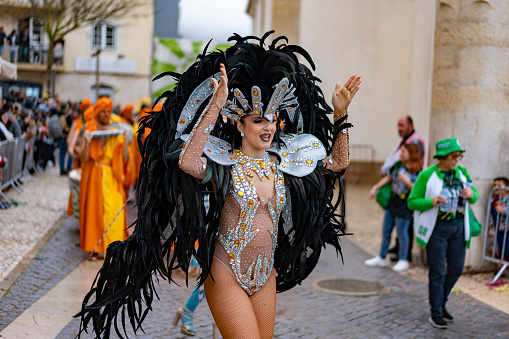 Nassau, Bahamas – December 26, 2022: A man in a traditional costume during a Junkanoo parade in the Bahamas.