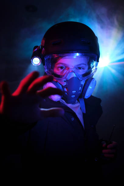 istock Boy in respirator committing robbery in darkness 2012883470
