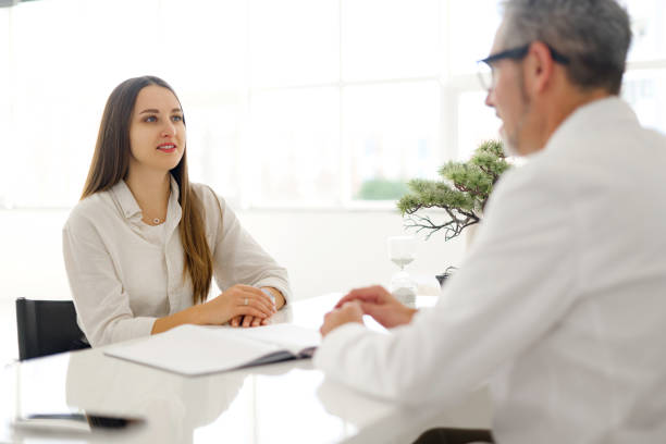 Businesswoman passing document to colleague