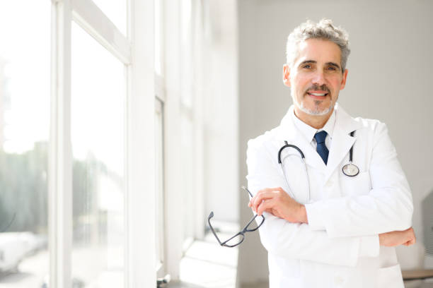 istock Experienced confident senior doctor with grey hair 2012888602