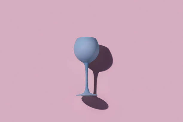 istock Pastel blue gray colored wine glass and sun shadow on colors background. Minimal style flat lay photo event or party concept. Top view wineglass Creative photo idea of summer cocktail drink 2012897735