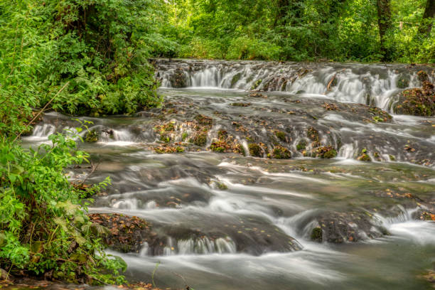 Turquoise color of water in the summer on the river Janj - Photo