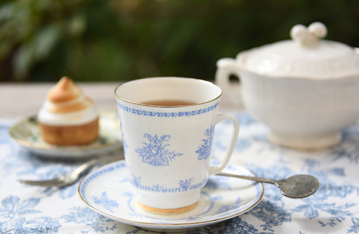 hot tea, English tea or tea cup and tea pot with carrot cake and mango cake
