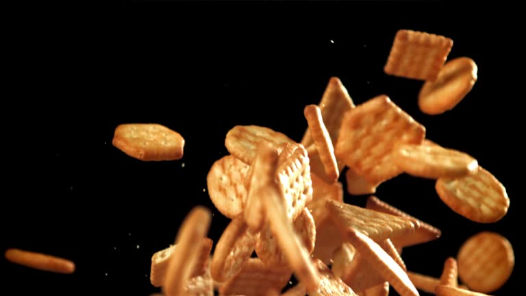 Cookies fly up and fall down. Filmed on a high-speed camera at 1000 fps.