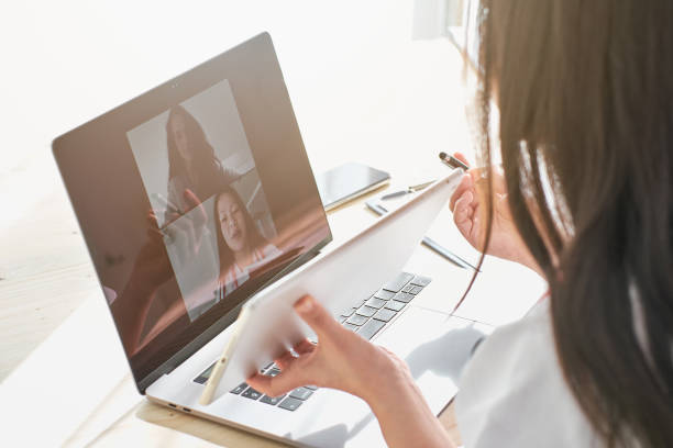 istock Asian doctor using tablet during online consultation with patien 2012918133
