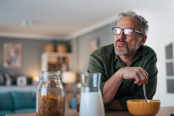 istock Portrait of senior man having breakfast 2012918672