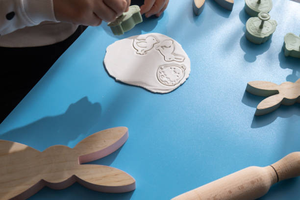 istock Children air dry clay activity handicraft idea. DIY process step by step instruction. Preparing for Easter holiday decorating. Modern organic design minimalistic plastic free sustainable 2012934432