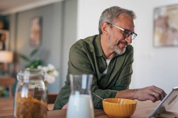 istock Handsome man reading fresh news 2012937417
