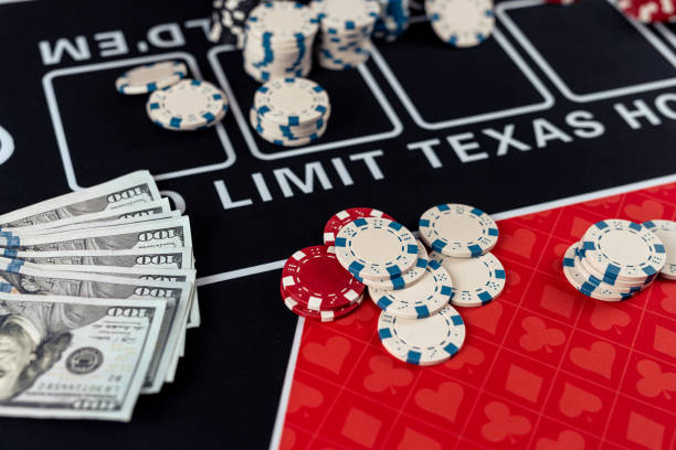 istock poker chips with playing cards on casino desk 2012965153