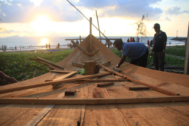 Banda Aceh, 01/01/2000,  the process of making traditional boats for Javanese village fishermen who still use wood as the basic material for the boat