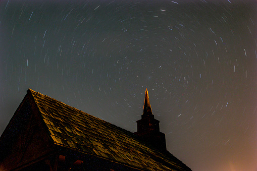 Star Trails in the Sky behind a small Chapel